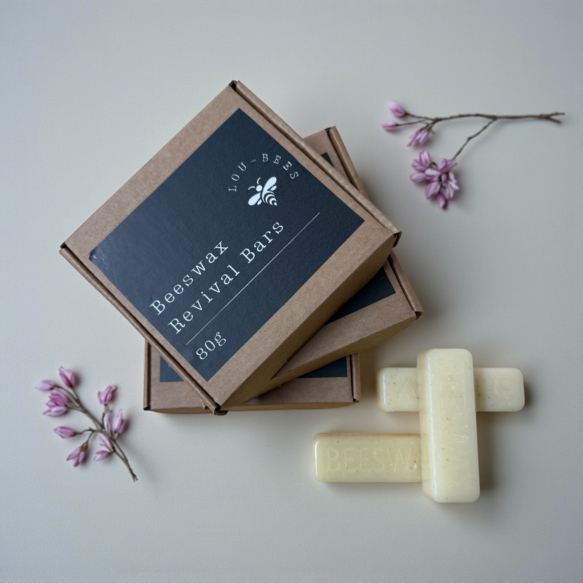 Beeswax revival bars with packaging on a light background