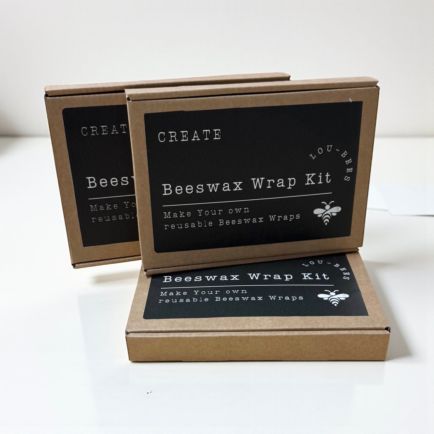 Beeswax wrap kit packaging with text on a white background