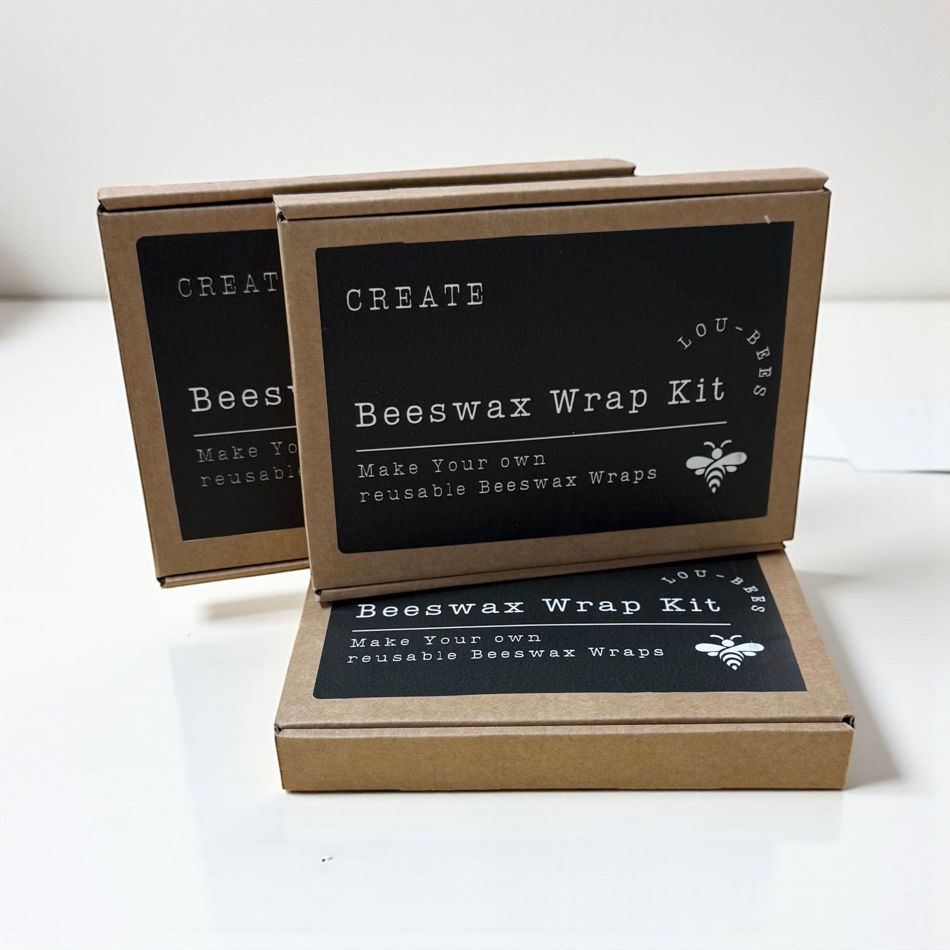 Beeswax wrap kit packaging with text on a white background